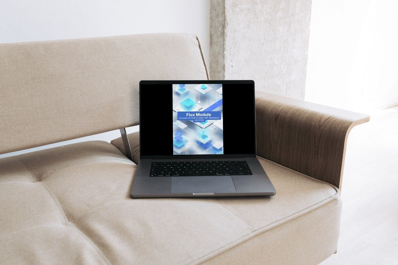 Laptop on a beige sofa with a blurred screen displaying text.